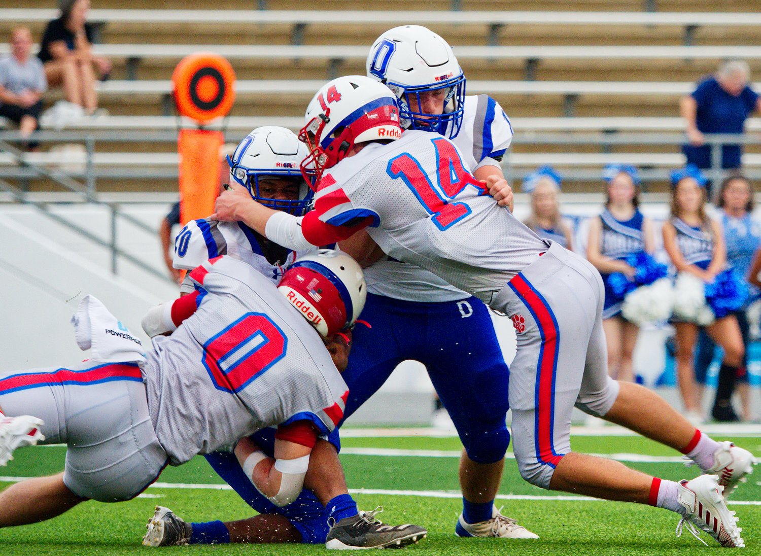 Jerry Skinner and Wyatt Sutton make the tackle for Alba-Golden. [find more football photos]